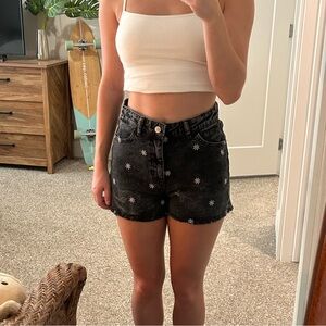 Black floral embroidered jean shorts